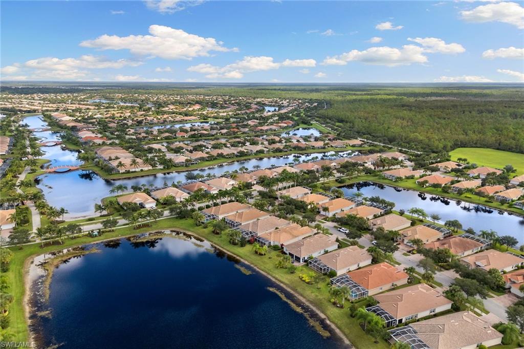 8407 Benelli Court Naples, FL 34114 - Photo 45 of 50 an aerial view of residential building and lake