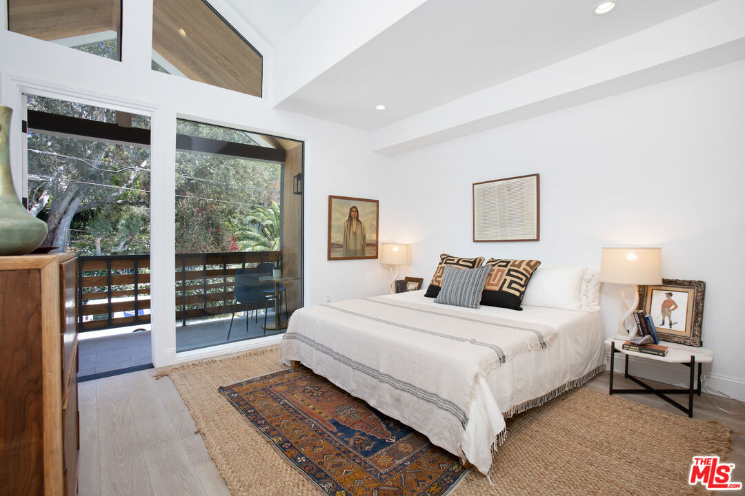 855 Merwin Street Los Angeles, CA 90026 - Photo 5 of 12 a bedroom with a large bed and a large window