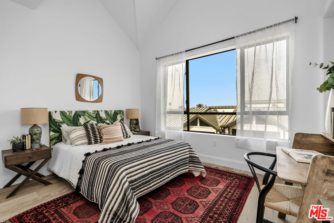 855 Merwin Street Los Angeles, CA 90026 - Photo 7 of 12 a bedroom with a bed and a chair