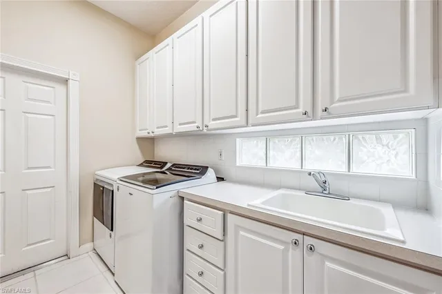 a kitchen with appliances cabinets and a window