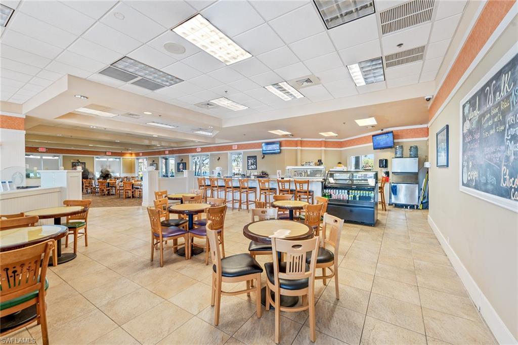 2881 Hatteras Way Naples, FL 34119 - Photo 31 of 32 a dining room with lots of furniture and clutter