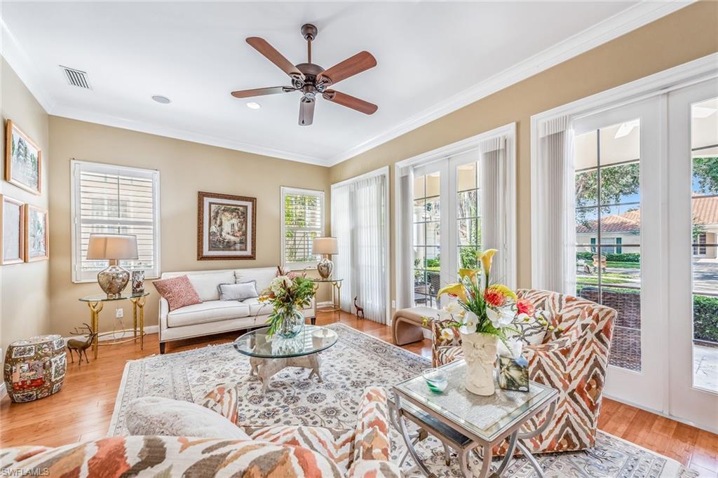 2881 Hatteras Way Naples, FL 34119 - Photo 6 of 32 a living room with furniture and a large window