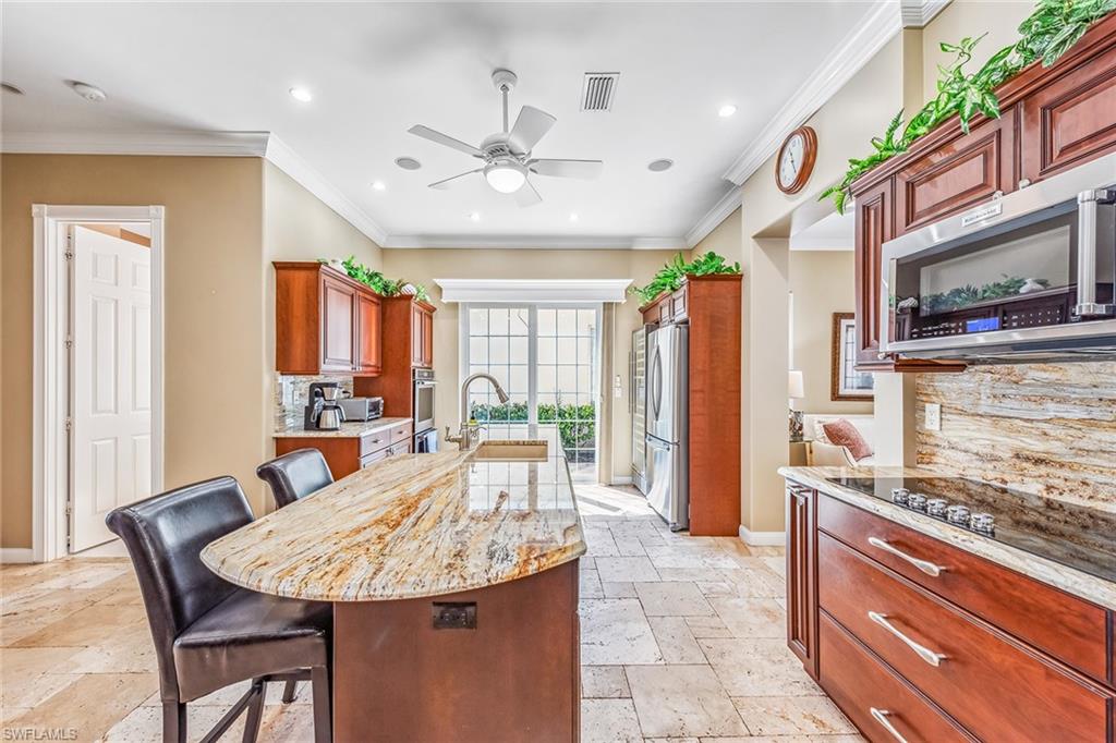 2881 Hatteras Way Naples, FL 34119 - Photo 10 of 32 a view of a dining room with furniture
