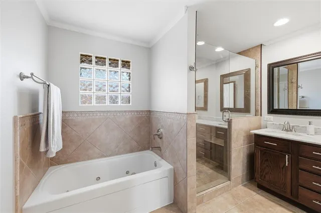 a bathroom with a tub sink and a mirror