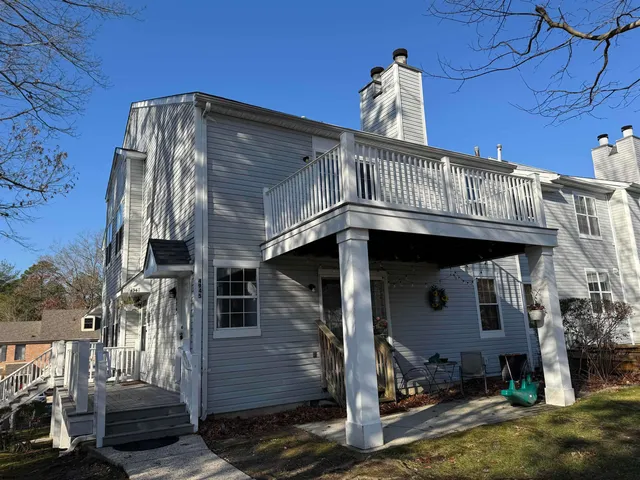 a view of a wooden house with a street