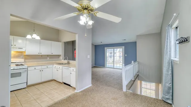 a view of a kitchen cabinets and a wooden floor