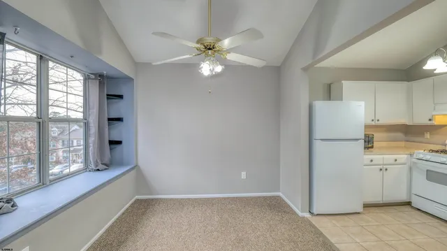 a view of a kitchen with a sink and a window