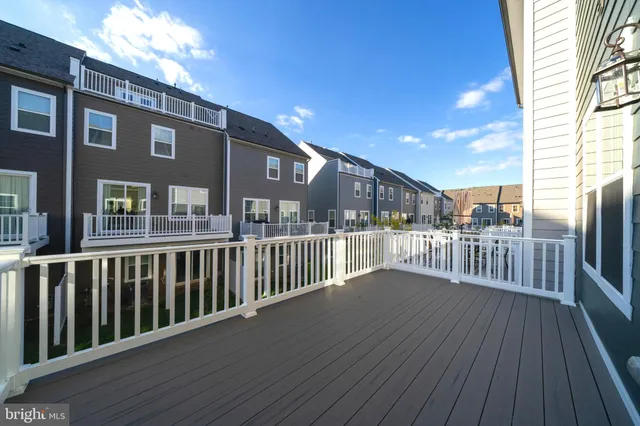 a view of a balcony with wooden floor