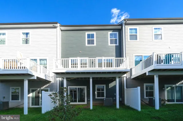a view of brick house with a large window and table