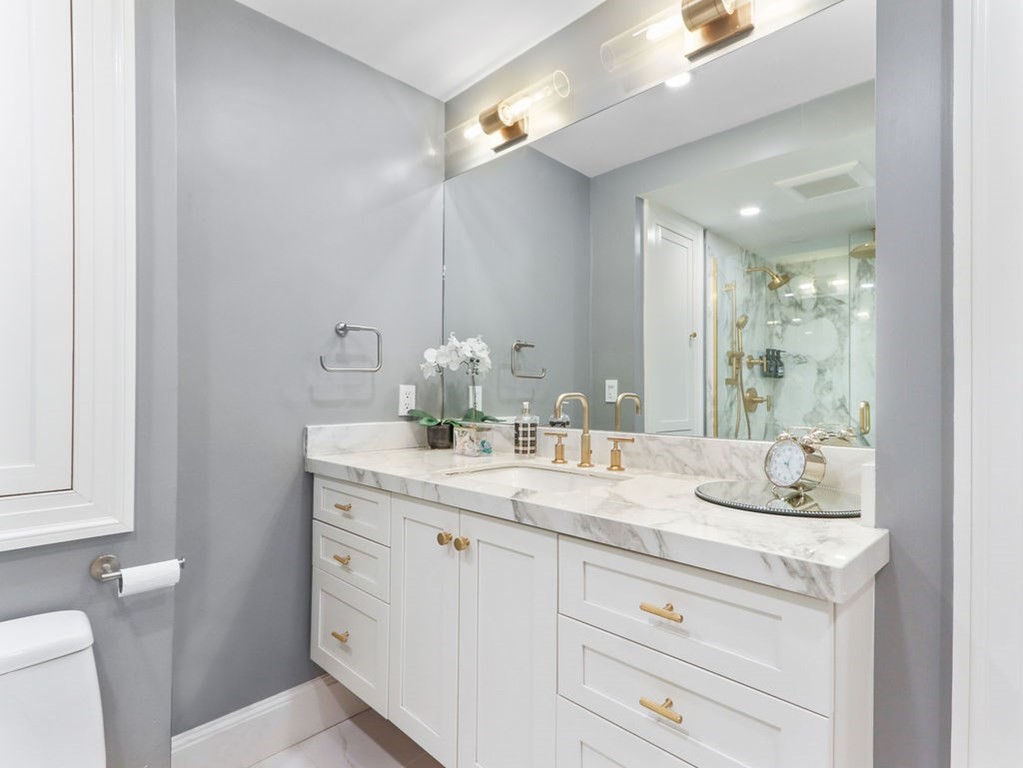 206 Beacon Street, Unit 1 Boston, MA 02116 - Photo 12 of 23 a bathroom with a granite countertop sink mirror and toilet