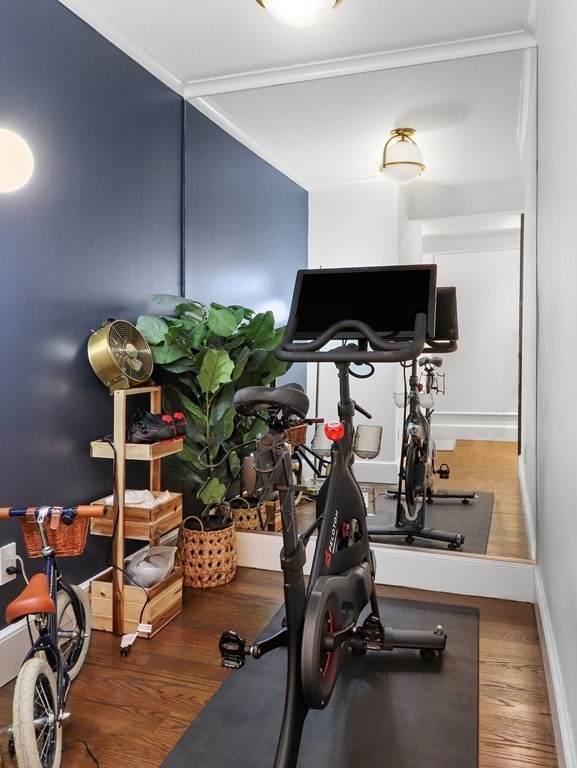 206 Beacon Street, Unit 1 Boston, MA 02116 - Photo 14 of 23 a room with gym equipment and a table