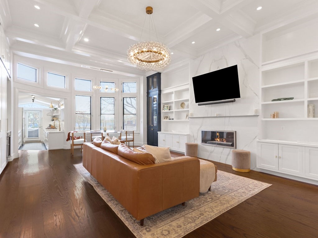 206 Beacon Street, Unit 1 Boston, MA 02116 - Photo 2 of 23 a living room with fireplace furniture and a flat screen tv