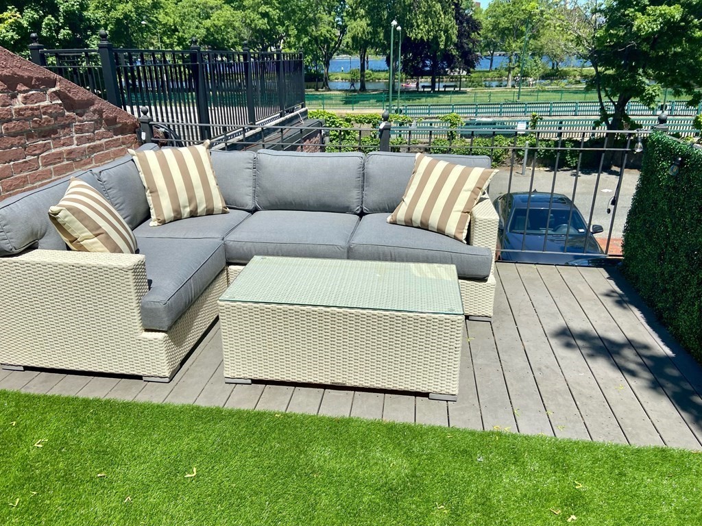 206 Beacon Street, Unit 1 Boston, MA 02116 - Photo 21 of 23 a view of backyard with outdoor seating and green space