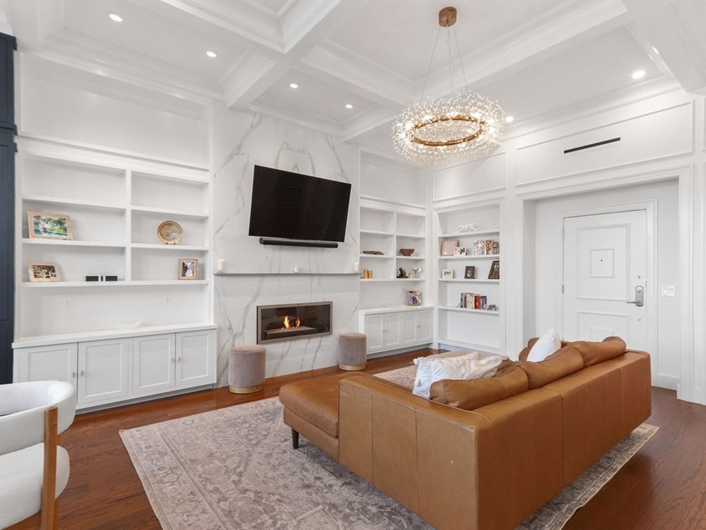 206 Beacon Street, Unit 1 Boston, MA 02116 - Photo 3 of 23 a living room with furniture and a flat screen tv