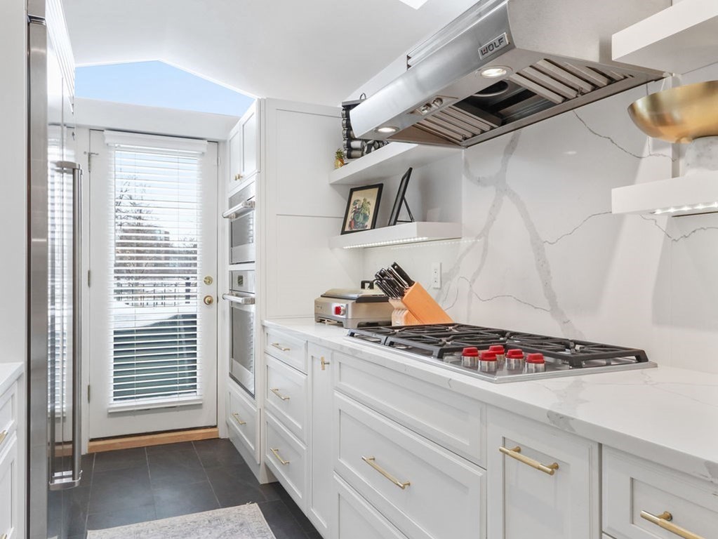 206 Beacon Street, Unit 1 Boston, MA 02116 - Photo 9 of 23 a view of kitchen with cabinets and stove