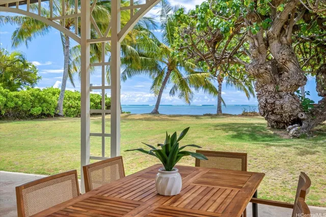 a view of swimming pool with a lounge chairs