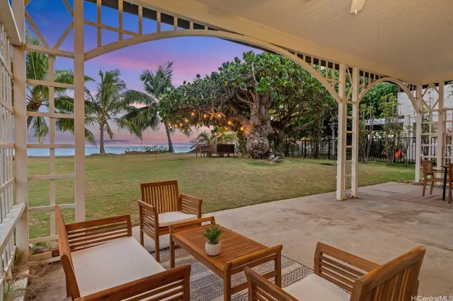 a view of a patio with a yard