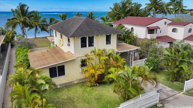 a house with swimming pool in front of it