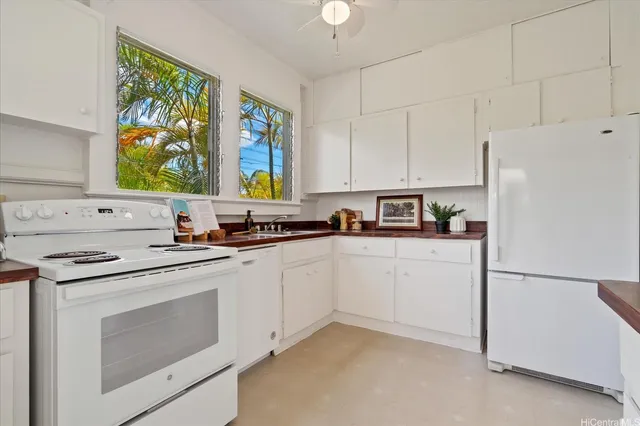 a kitchen with appliances cabinets and a sink
