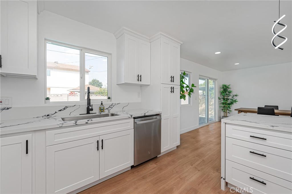 7201 Cerritos Avenue Stanton, CA 90680 - Photo 14 of 35 a kitchen with a white cabinets and window