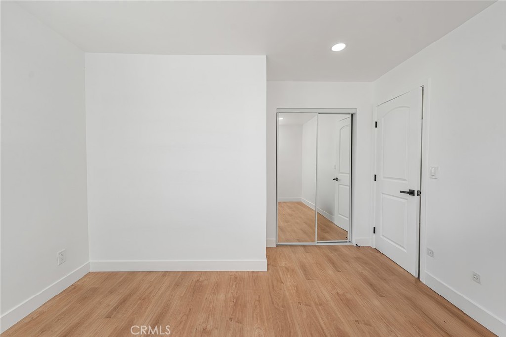 7201 Cerritos Avenue Stanton, CA 90680 - Photo 17 of 35 a view of an empty room with wooden floor