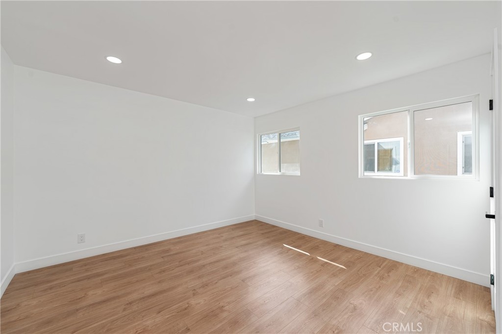 7201 Cerritos Avenue Stanton, CA 90680 - Photo 24 of 35 a view of empty room with wooden floor and fan