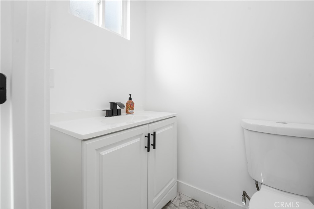7201 Cerritos Avenue Stanton, CA 90680 - Photo 27 of 35 a bathroom with a sink and a vanity
