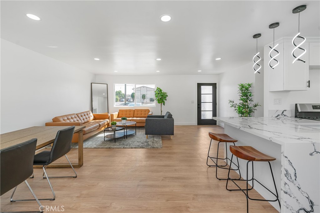 7201 Cerritos Avenue Stanton, CA 90680 - Photo 6 of 35 a living room with furniture kitchen view and a large window
