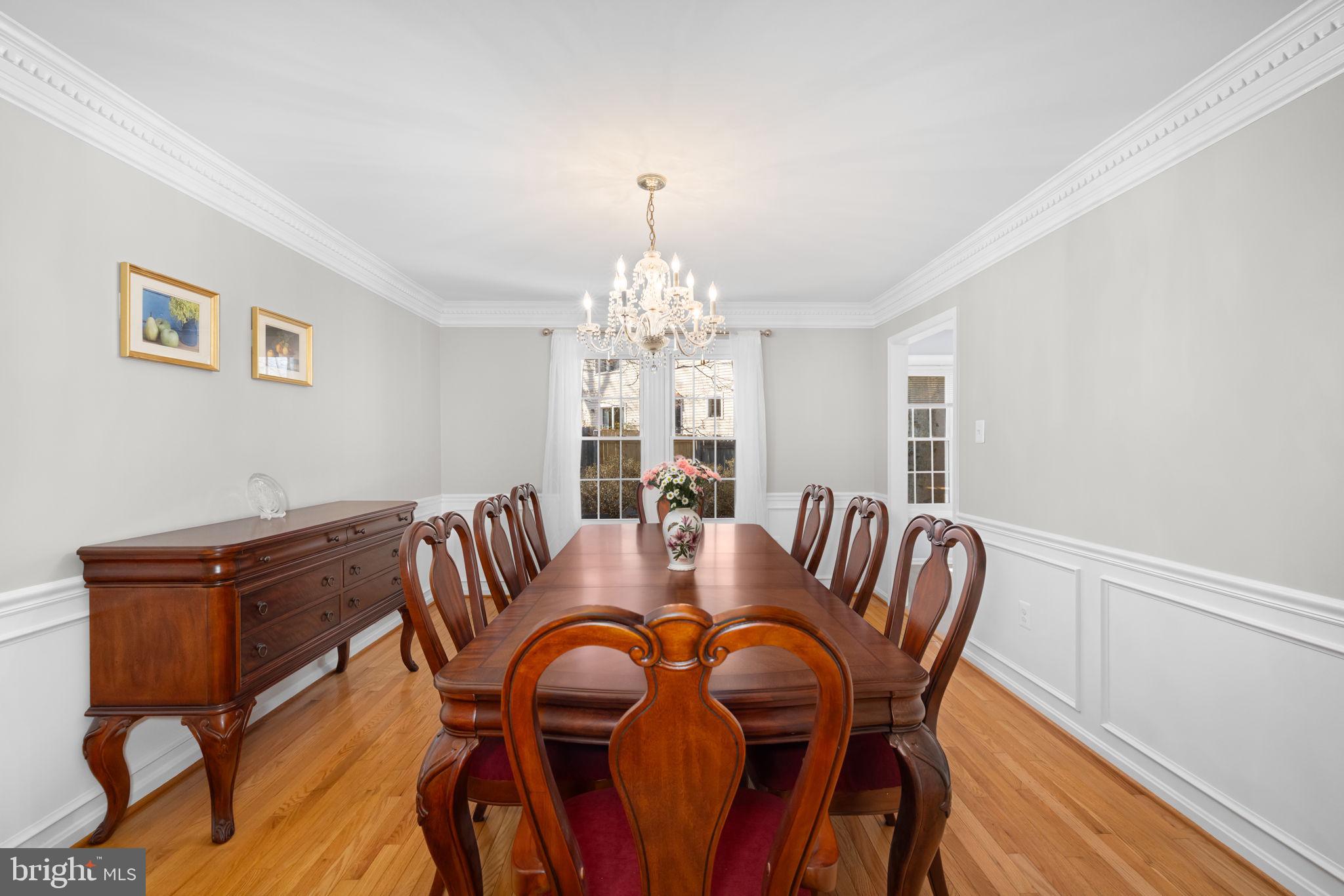 9451 Lapstrake Lane Burke, VA 22015 - Photo 20 of 59 a view of a dining room with furniture window and wooden floor