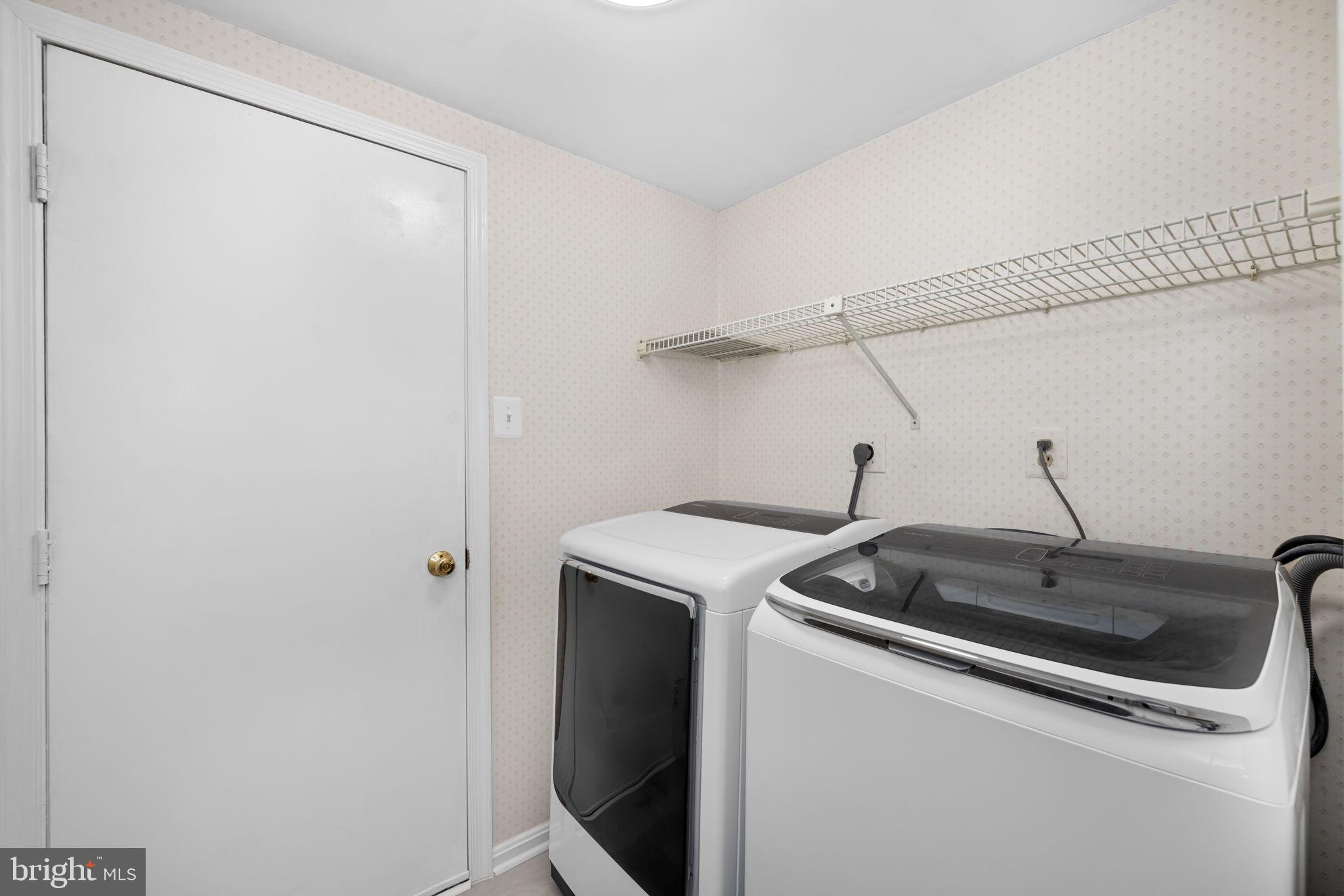 9451 Lapstrake Lane Burke, VA 22015 - Photo 24 of 59 a utility room with dryer and washer