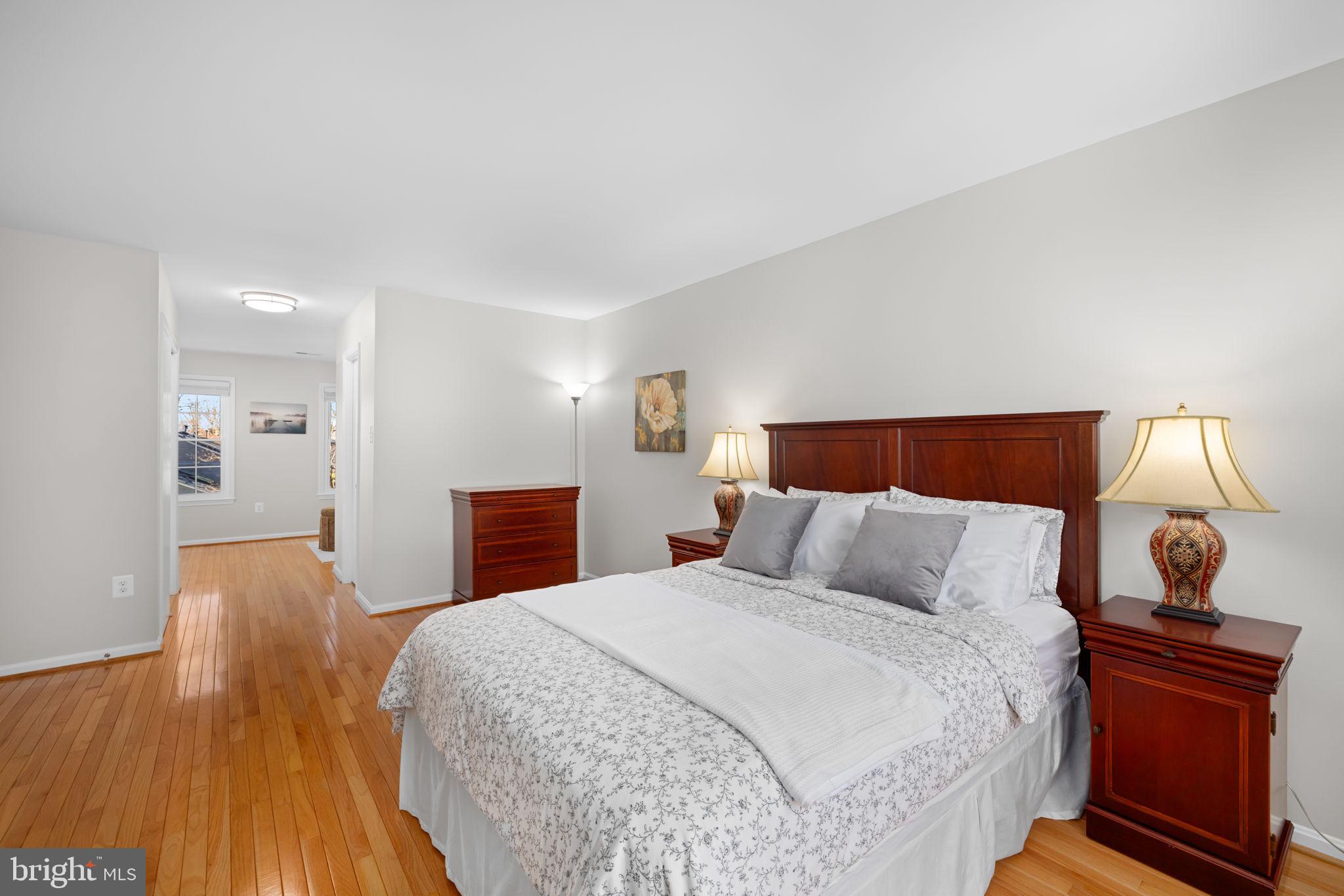 9451 Lapstrake Lane Burke, VA 22015 - Photo 25 of 59 a bedroom with a bed and wooden floor