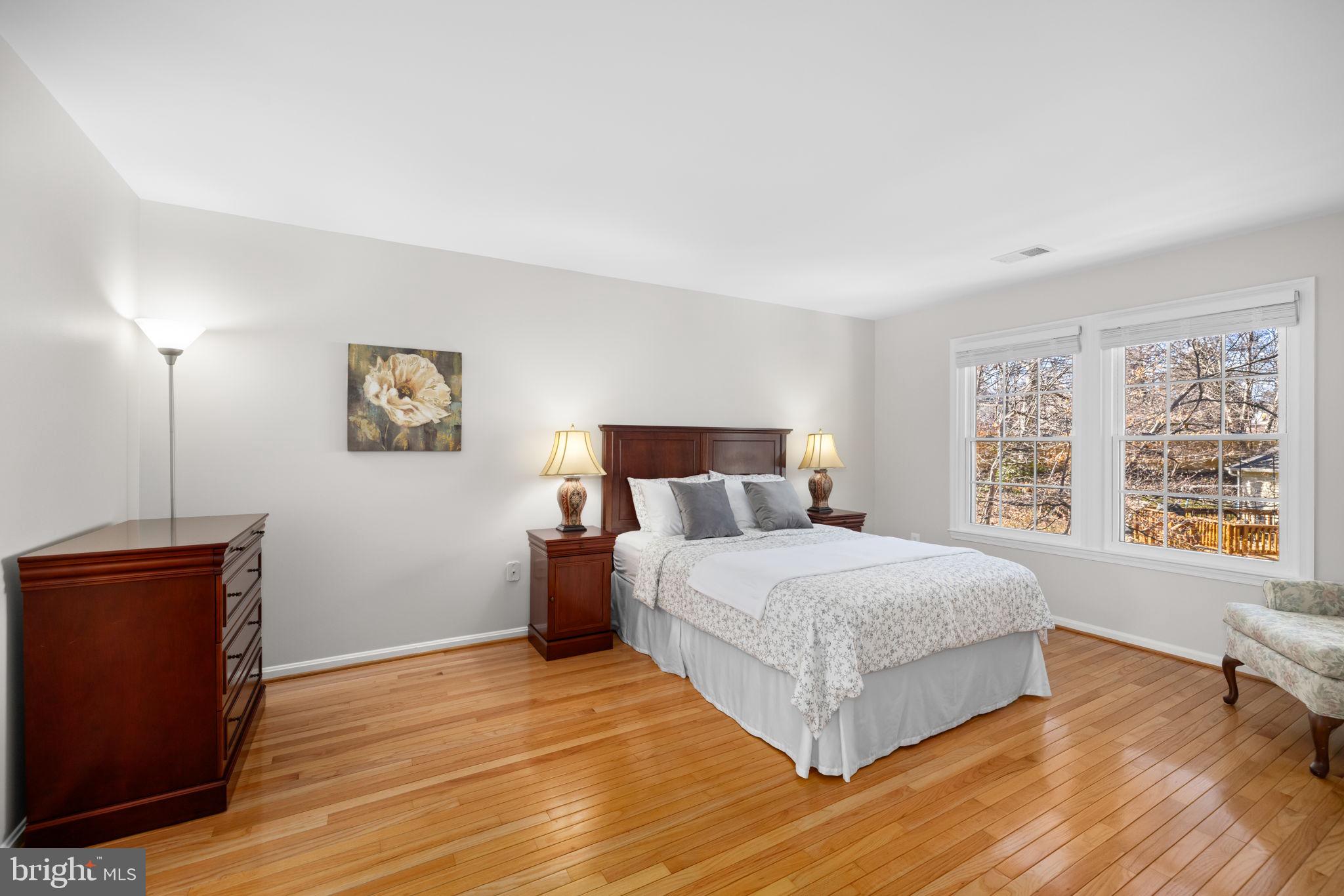 9451 Lapstrake Lane Burke, VA 22015 - Photo 26 of 59 a bedroom with a large bed and a window
