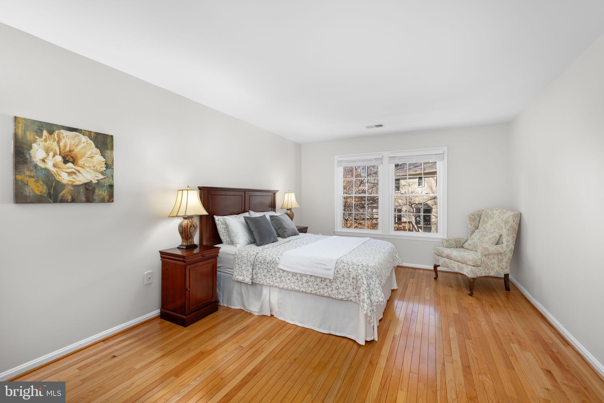 9451 Lapstrake Lane Burke, VA 22015 - Photo 27 of 59 a bedroom with a bed and wooden floor