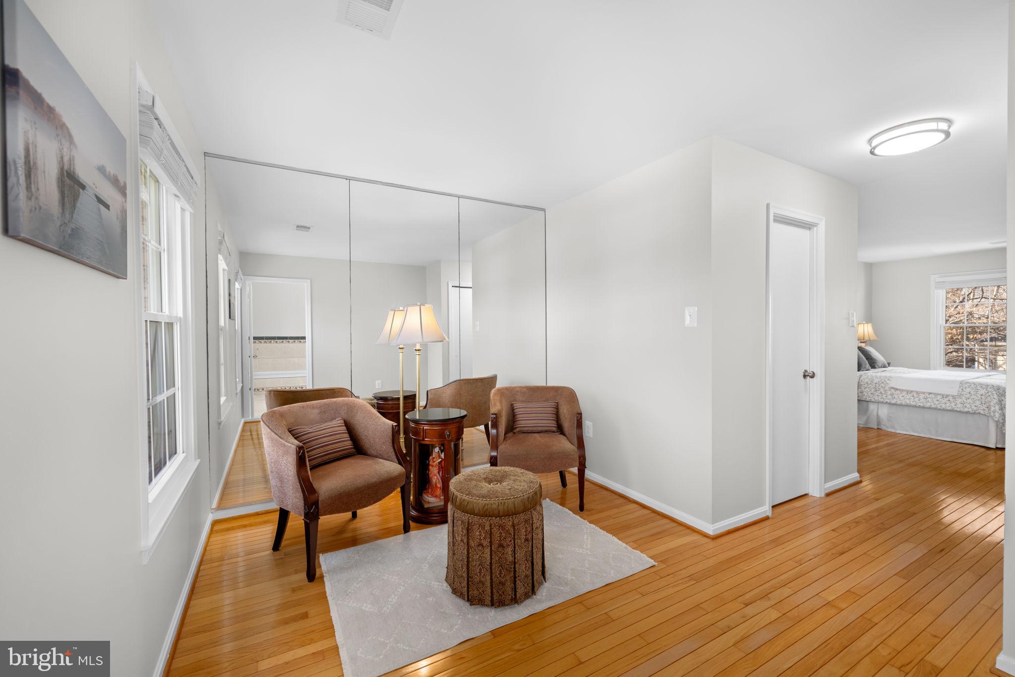 9451 Lapstrake Lane Burke, VA 22015 - Photo 29 of 59 a living room with furniture and a wooden floor