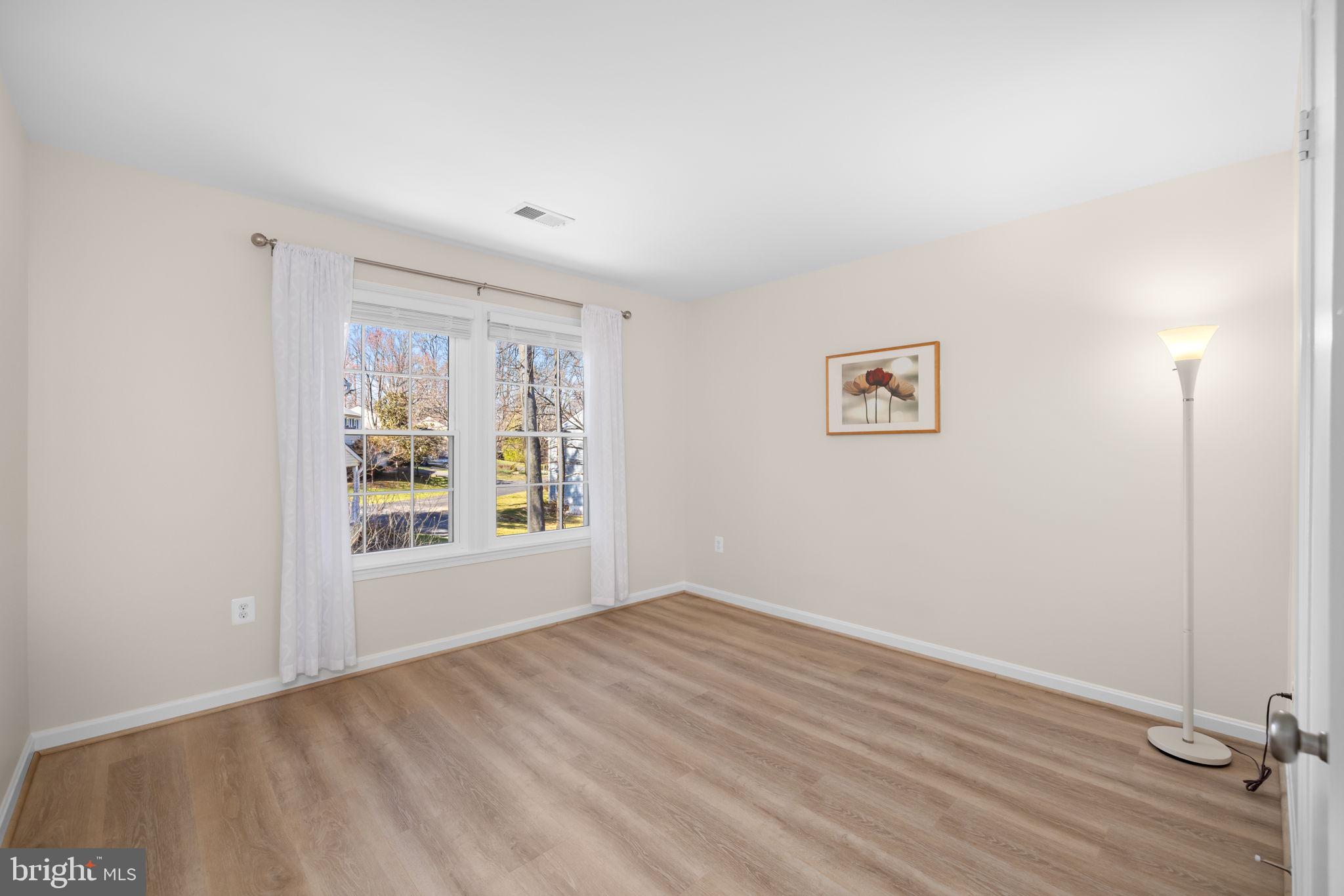 9451 Lapstrake Lane Burke, VA 22015 - Photo 35 of 59 a view of an empty room with a window