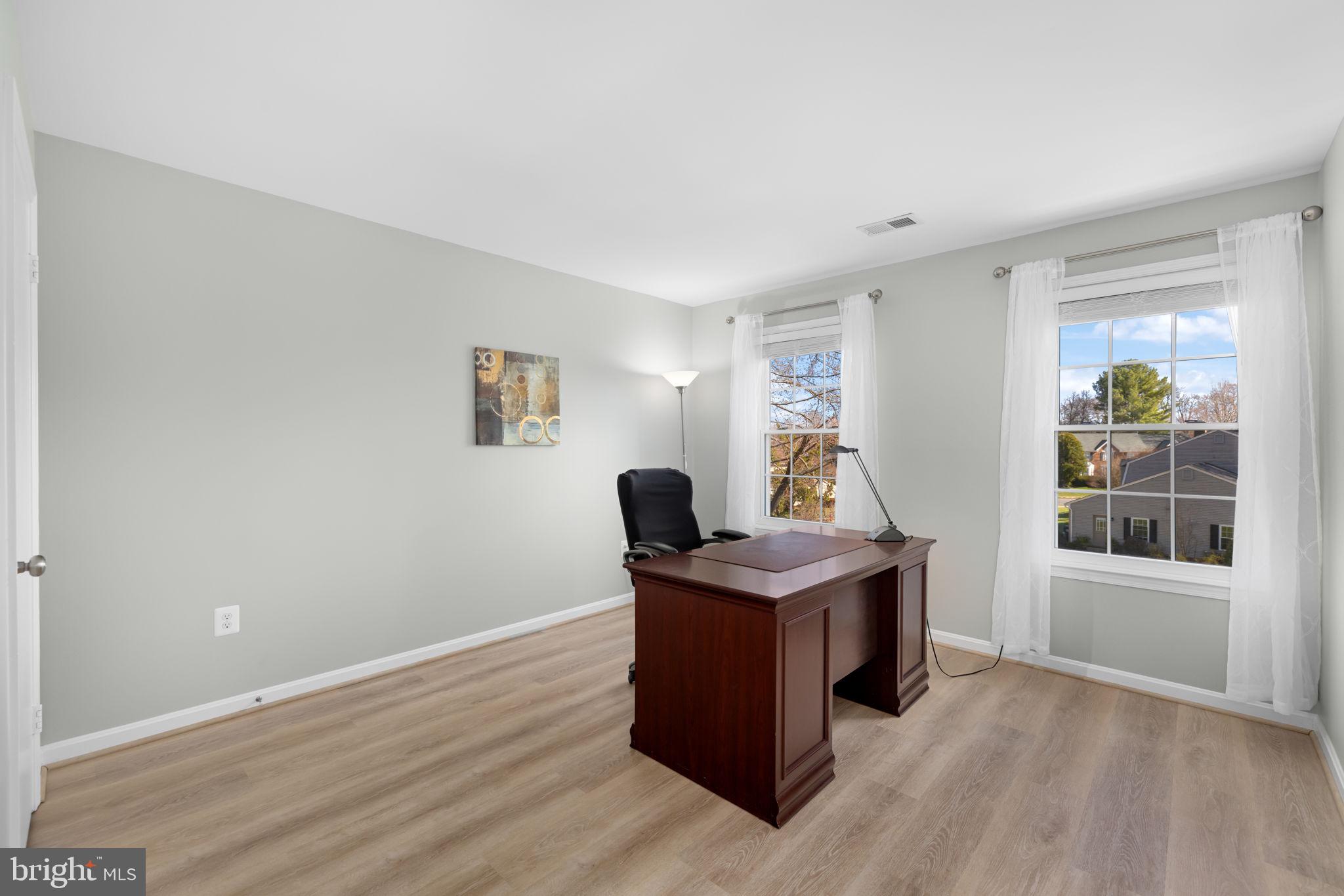 9451 Lapstrake Lane Burke, VA 22015 - Photo 36 of 59 a view of a workspace with furniture and a window