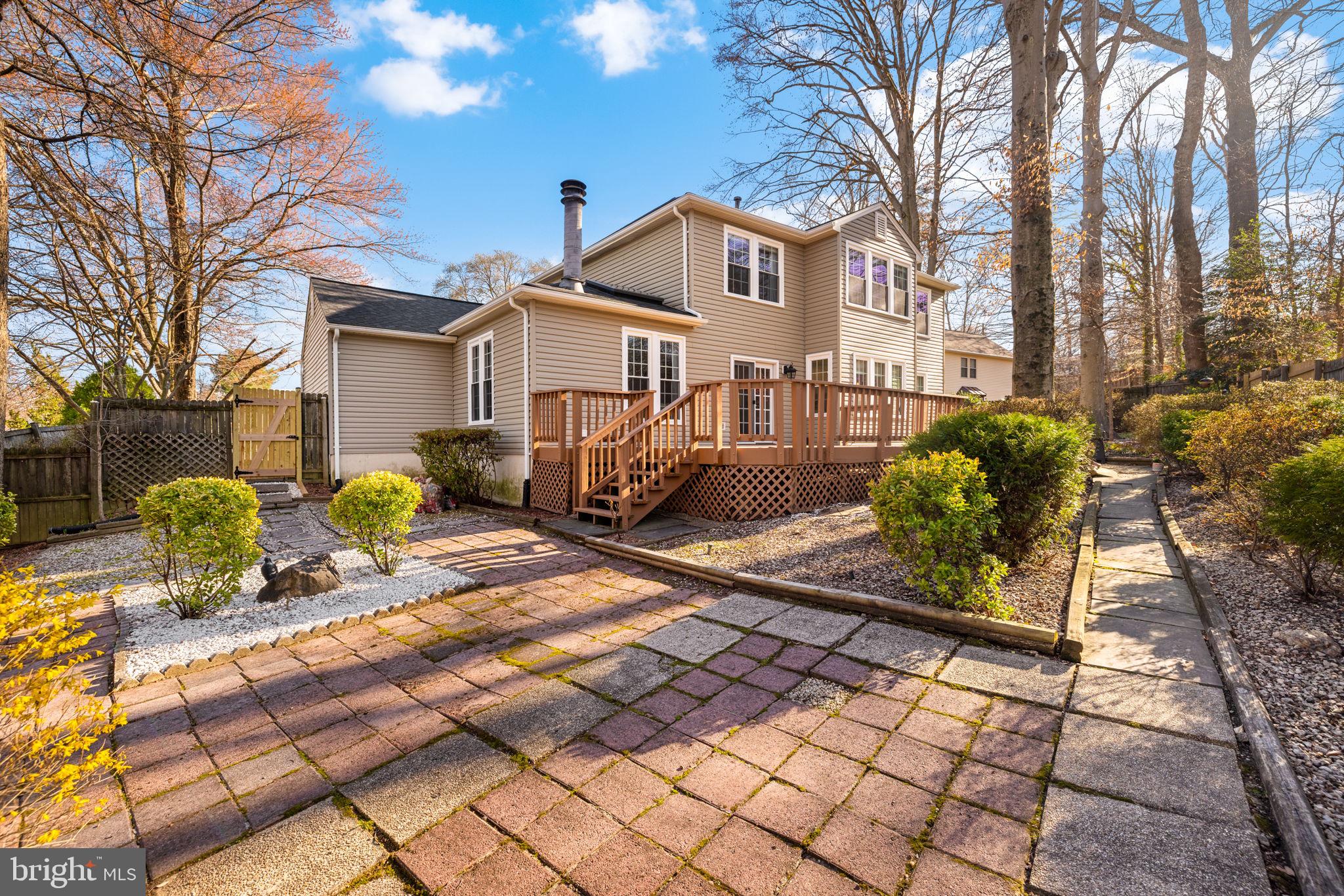 9451 Lapstrake Lane Burke, VA 22015 - Photo 50 of 59 a front view of a house with garden