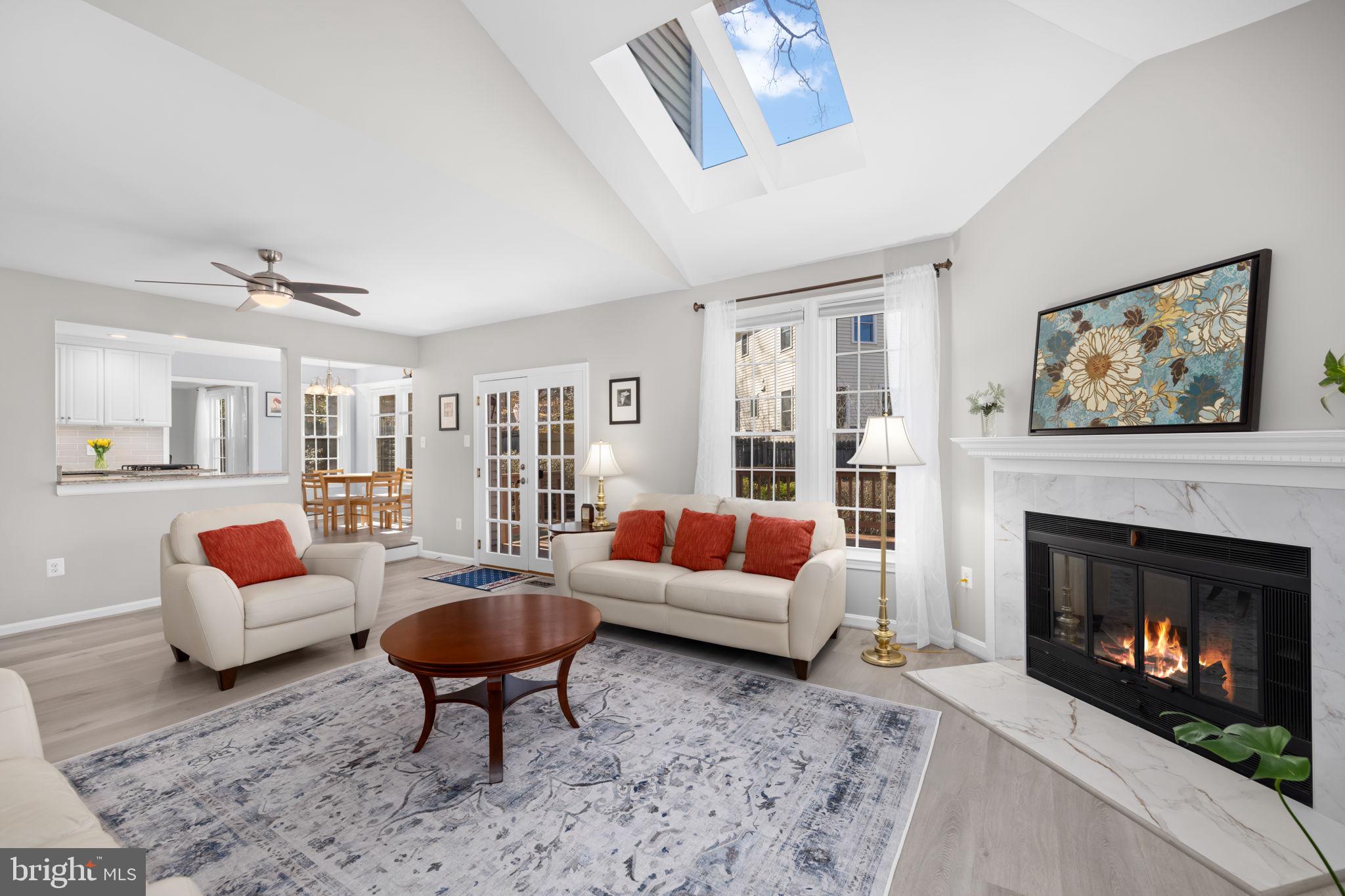 9451 Lapstrake Lane Burke, VA 22015 - Photo 5 of 59 a living room with furniture a lamp and a fireplace