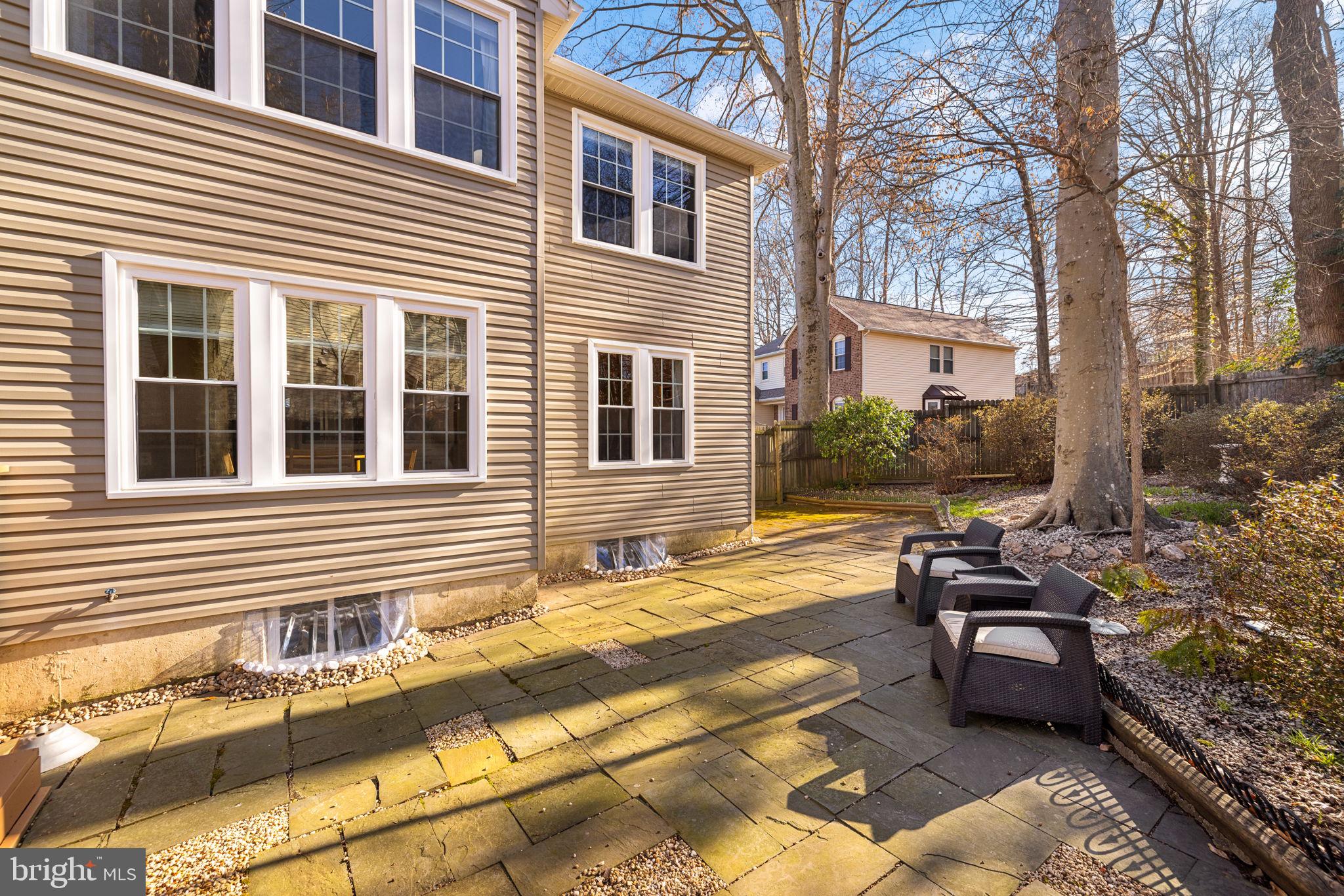 9451 Lapstrake Lane Burke, VA 22015 - Photo 52 of 59 a view of a patio with chairs and tables