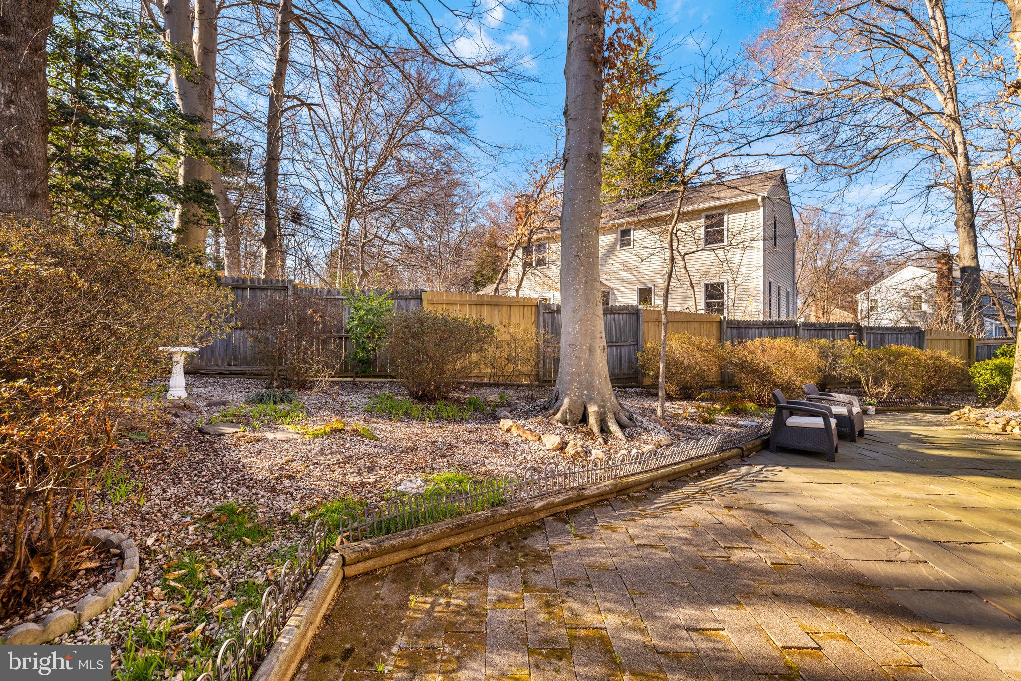 9451 Lapstrake Lane Burke, VA 22015 - Photo 53 of 59 a view of a backyard with table and chairs and a fire pit