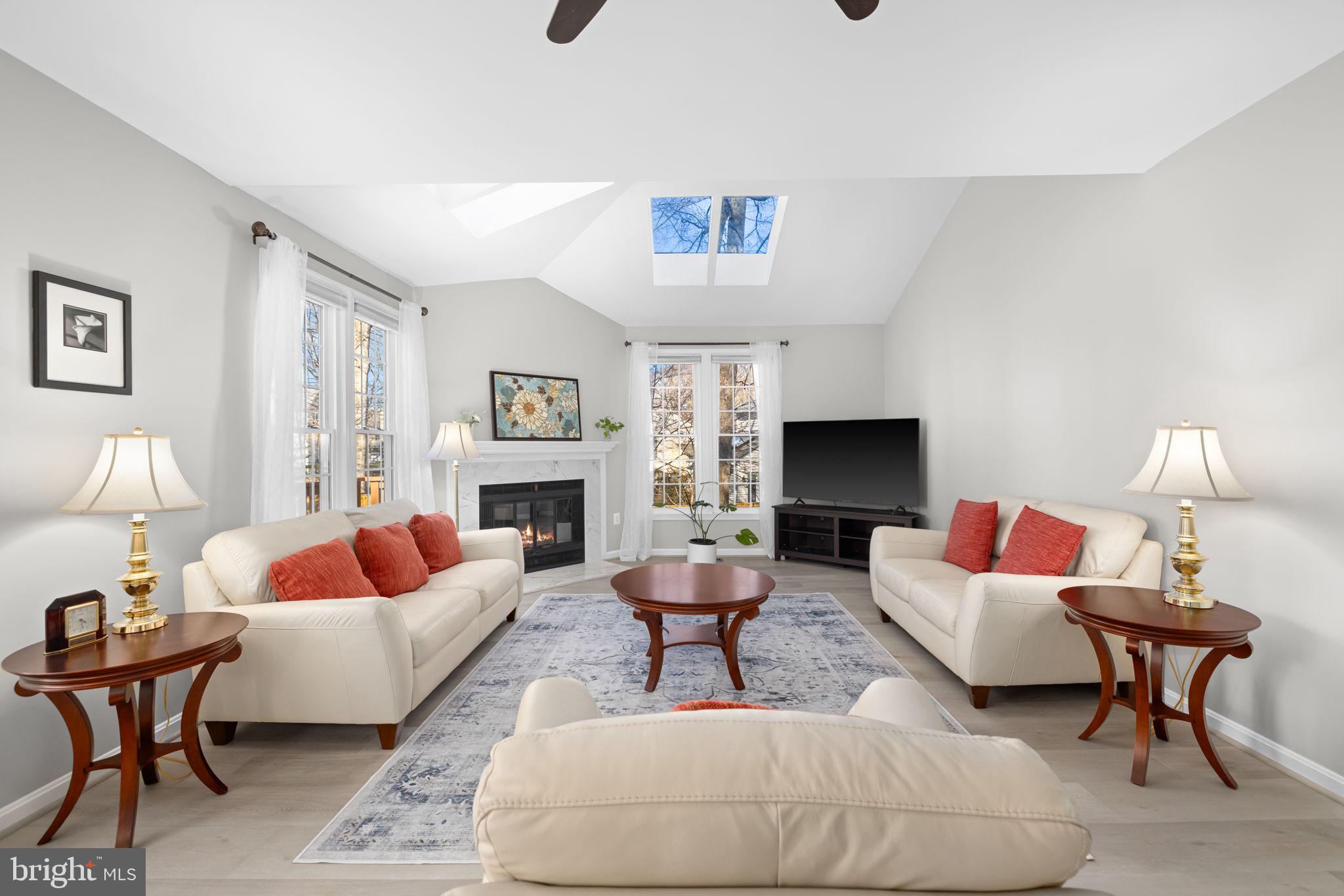 9451 Lapstrake Lane Burke, VA 22015 - Photo 7 of 59 a living room with furniture and a fireplace