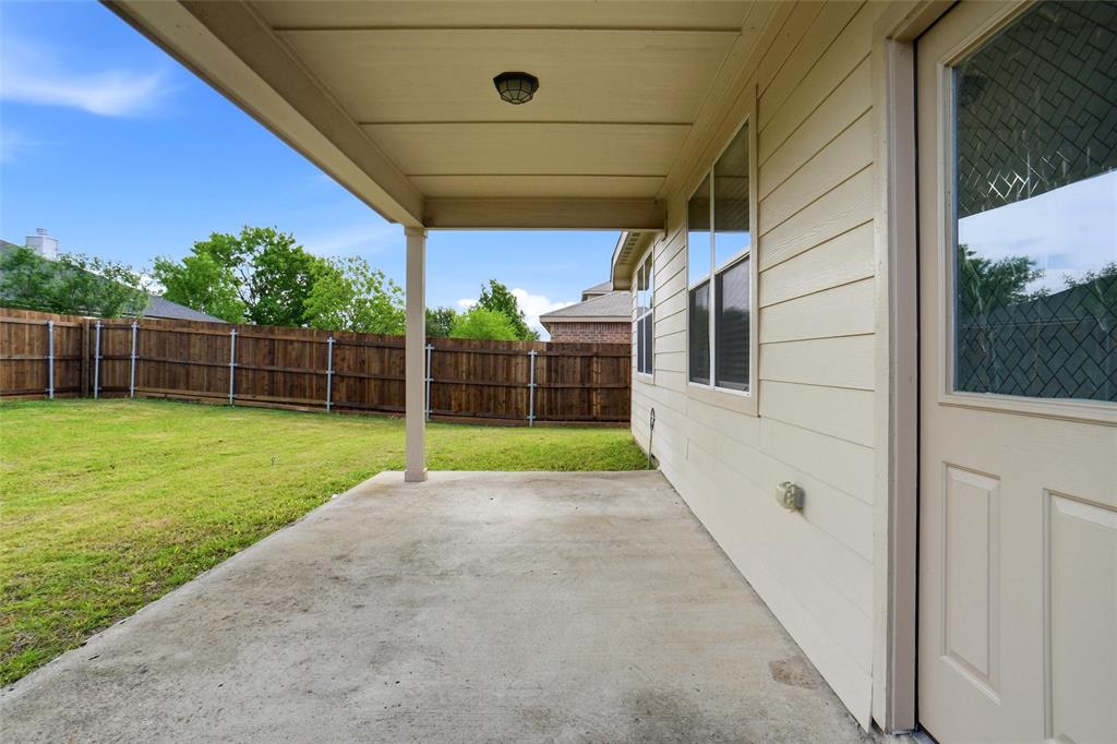 216 Meadow Ridge Drive Anna, TX 75409 - Photo 3 of 16 a view of a backyard with plants and a backyard