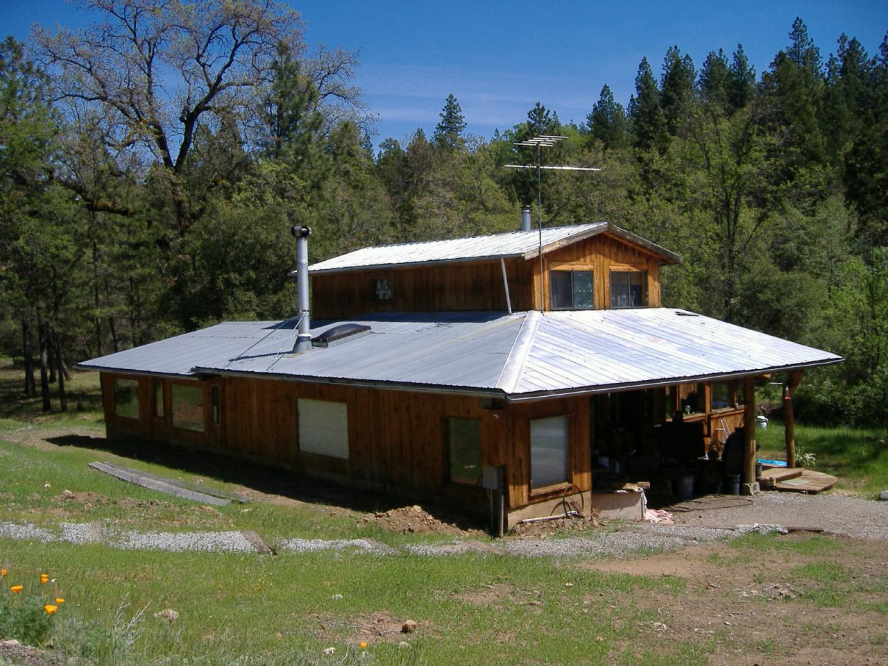 31625 Grindley Road Whitmore, CA 96096 - Photo 1 of 8 a view of a house with a yard