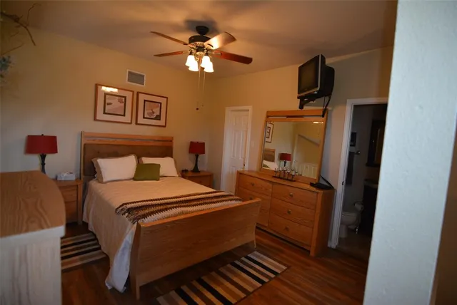 a bed room with a bed and a chandelier