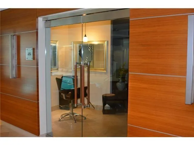 a view of a swimming pool with lawn chairs