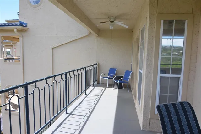 a view of balcony with furniture