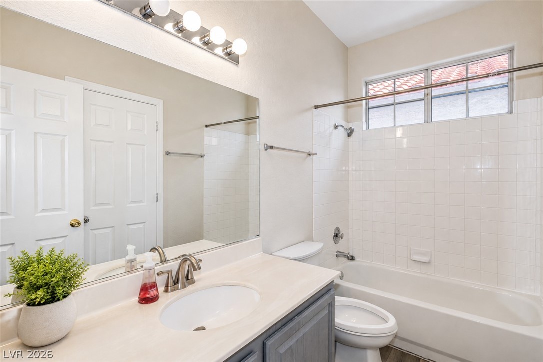 2278 Ramsgate Drive Henderson, NV 89074 - Photo 23 of 34 A well-appointed bathroom features a single vanity, a combination shower and tub, and natural light from a high-set window.