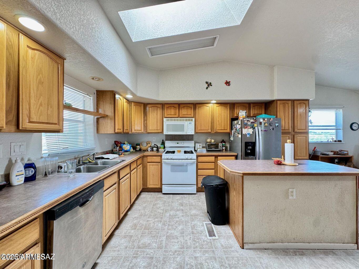 2627 West Hansen Road Willcox, AZ 85643 - Photo 12 of 42 a kitchen with stainless steel appliances a sink window and cabinets