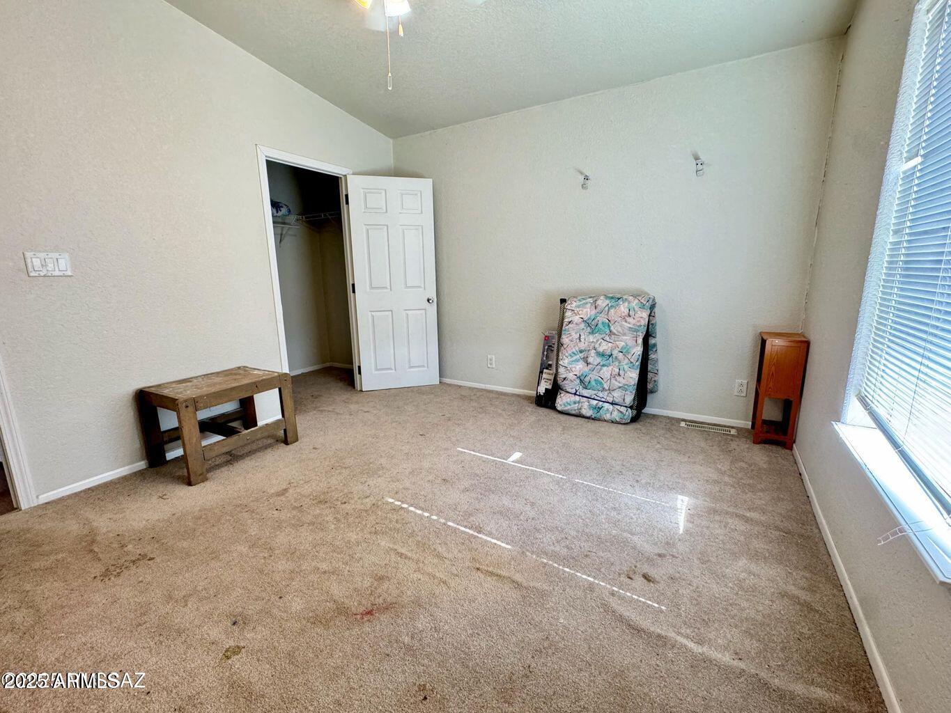 2627 West Hansen Road Willcox, AZ 85643 - Photo 19 of 42 a view of an empty room with a window