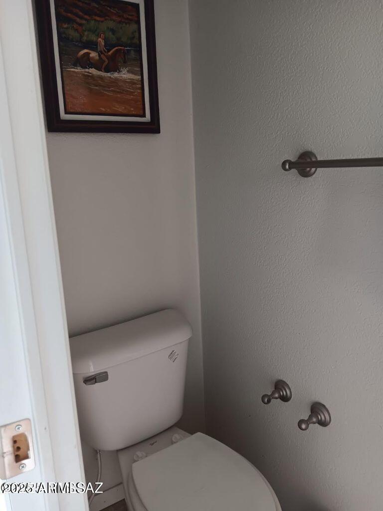 2627 West Hansen Road Willcox, AZ 85643 - Photo 22 of 42 a white toilet sitting next to a small bathroom